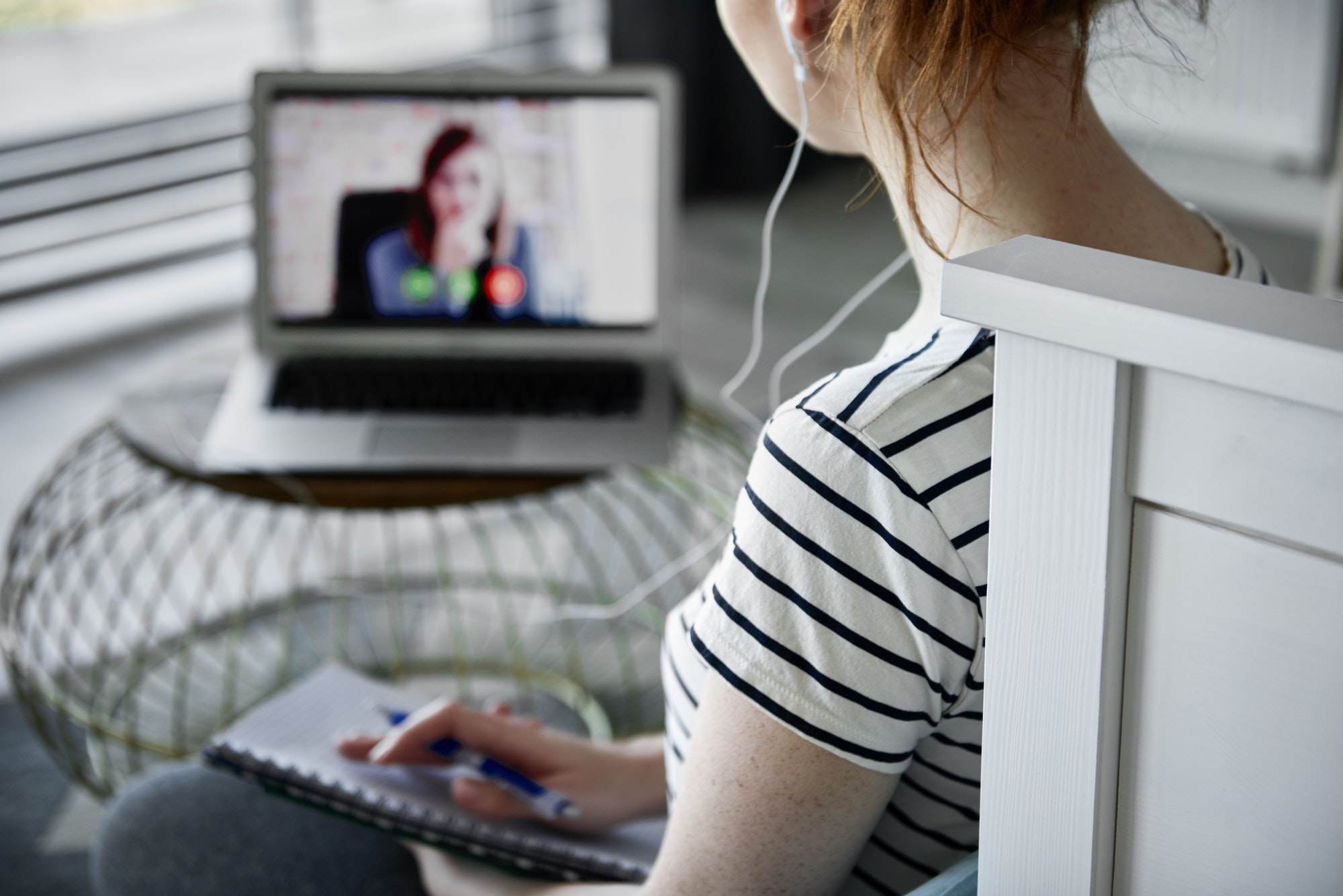 Rear view of woman having a video conference